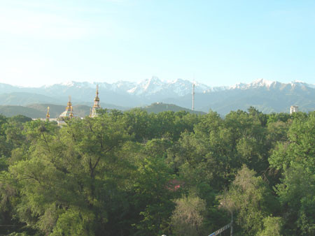 Back in Almaty, the view from the hotel window reveals our final destination – the Tien Shan Mountains…