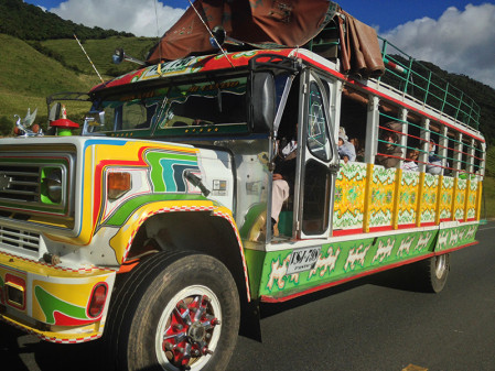 ... and we would love to travel onboard one of the colorful 'chiva' public buses, but they are too slow for us...