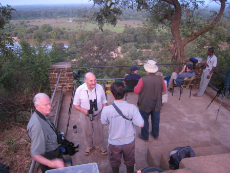 The view from the lodge, overlooking the water holes, is best appreciated with a cold beer,
